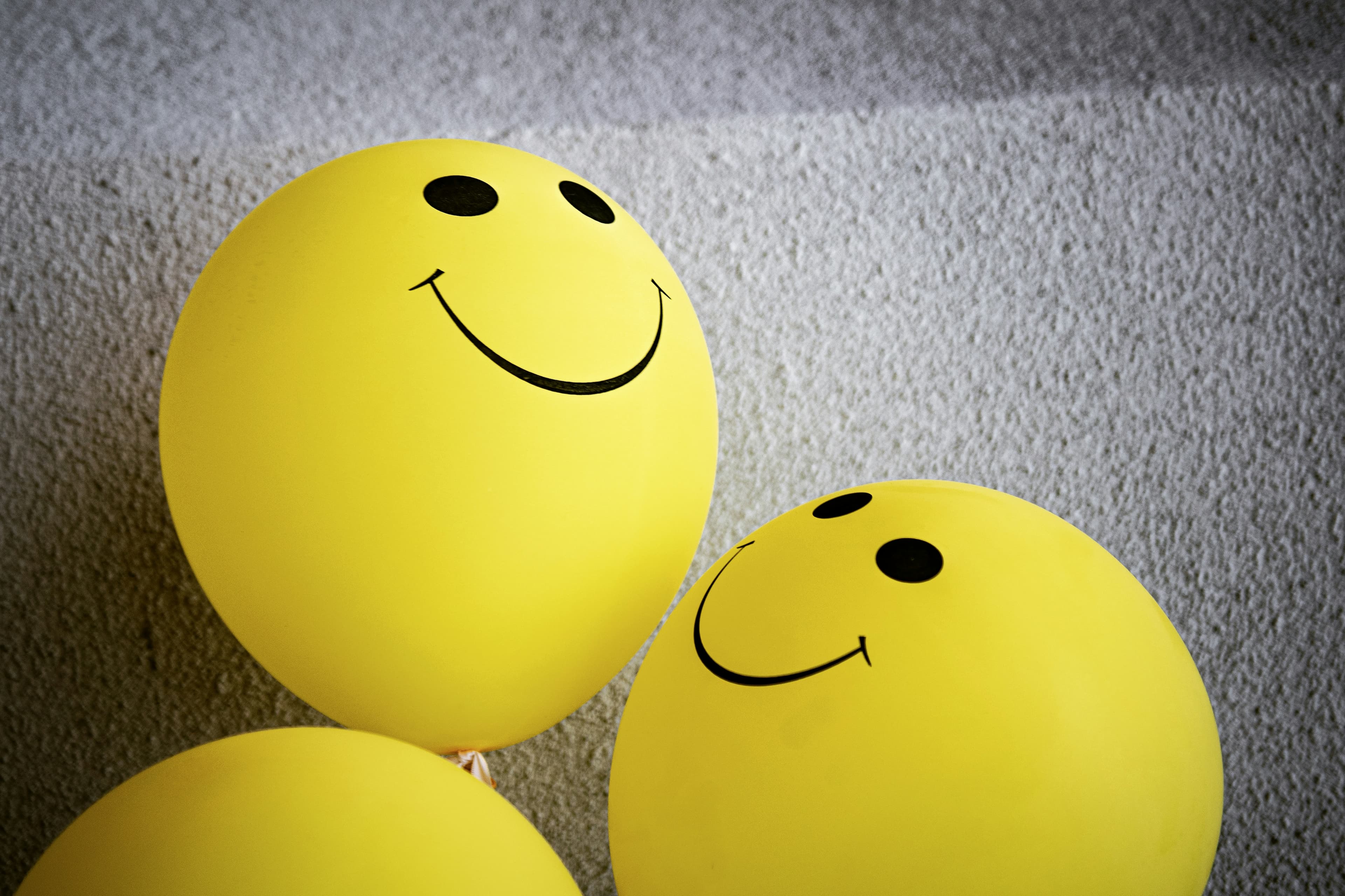 Yellow balloons with smiling faces